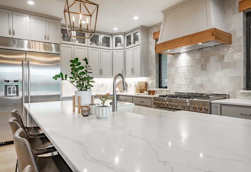 Stylish kitchen with white marble countertops and appliances in the Greater Orlando Area.