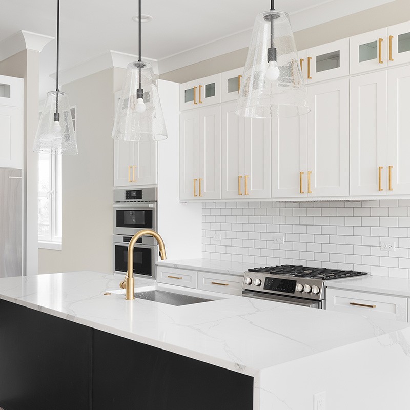 Bright kitchen with white cabinetry and black granite countertops in the Greater Orlando Area