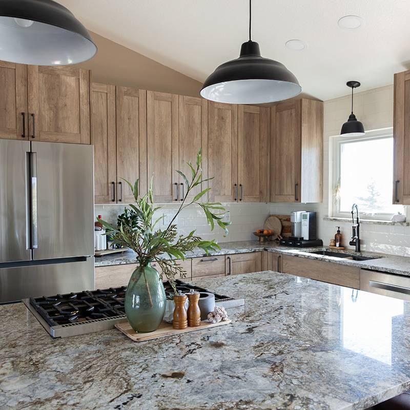 Kitchen space with white cabinets and black quartz countertops in the Greater Orlando Area